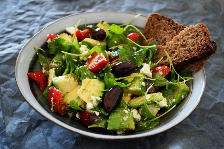 Wholesome and Fresh: Enjoy a Vegetable Salad with Wheat Bread On the Side