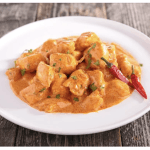 instantrecipies - Authentic Indian Butter Chicken (Murgh Makhani) served with basmati rice and naan on a white plate – a quick and easy instant recipe for rich, creamy curry at home
