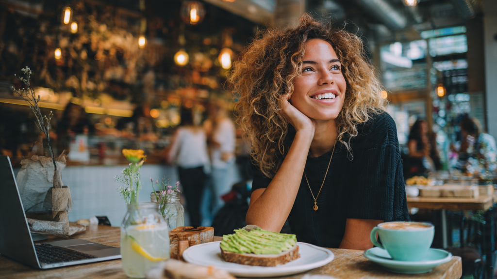 Young adult trying trendy food at a café